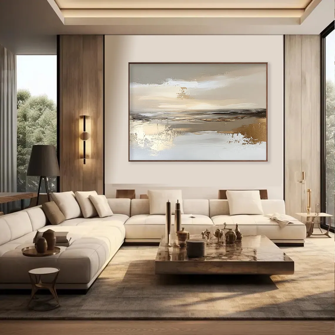 Living amplio con un cuadro panorámico en beige y dorado sobre el sofá
