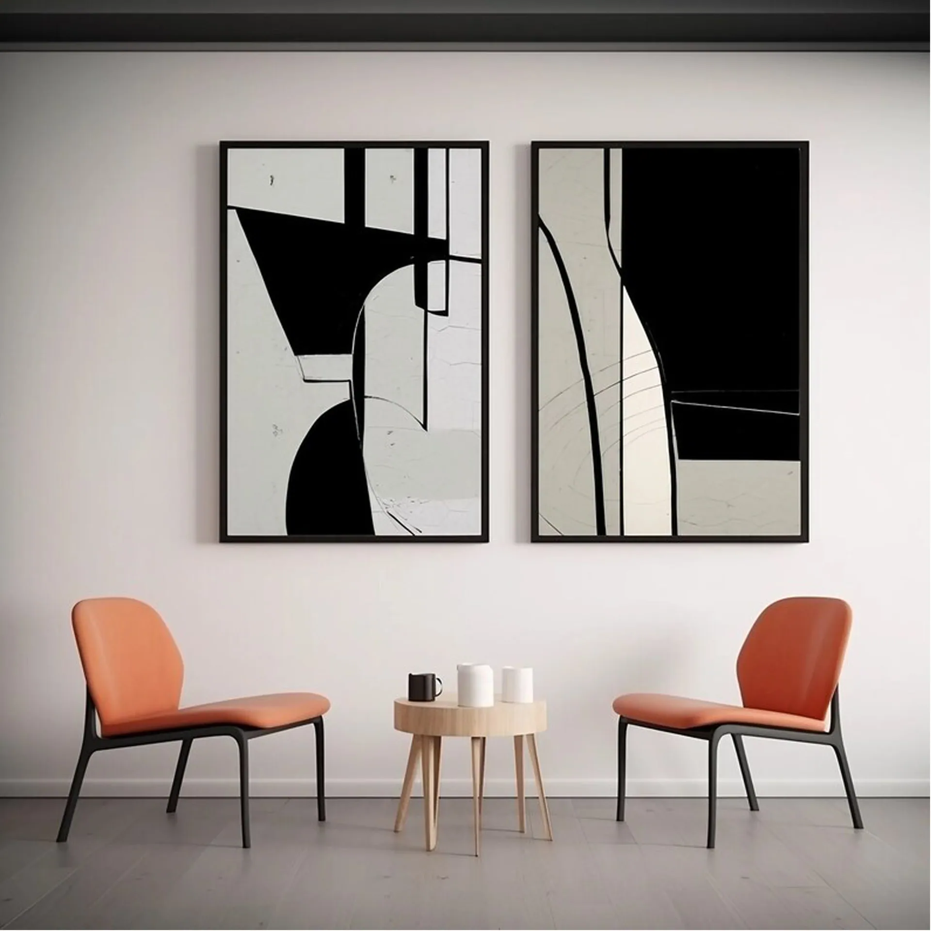 Set de dos cuadros abstractos en blanco y negro con marco negro, sobre dos sillones terracota